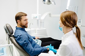 Dentist and patient having a conversation