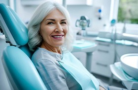 Smiling dental patient in treatment chair