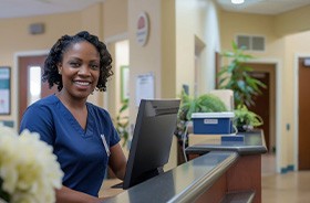 Dental team member at front desk