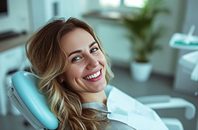 Smiling woman in dental treatment chair