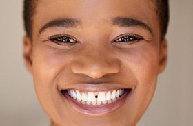 Portrait of smiling woman with a gap between her two front incisors